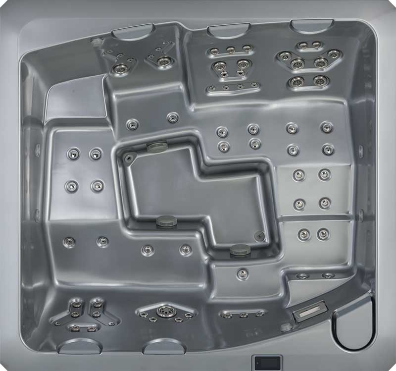 Bovenaanzicht van een grijs USSPA-spabad met ergonomische zitplaatsen en meerdere jetzones.